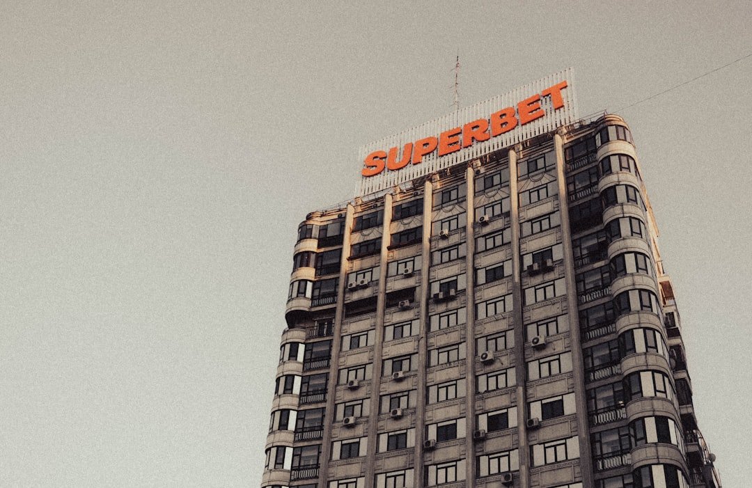 a tall building with a sign on top of it
