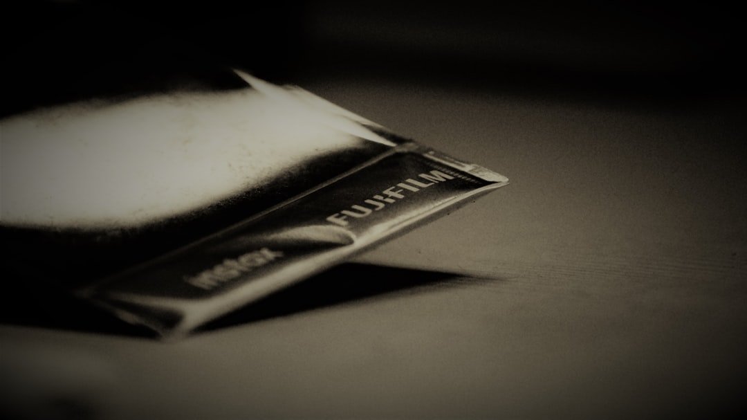 grayscale photo of Fujifilm pack