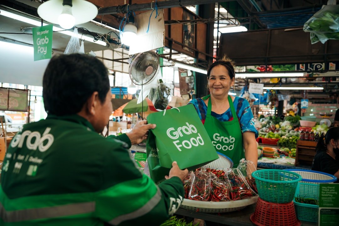 a woman holding a green bag in a grocery store