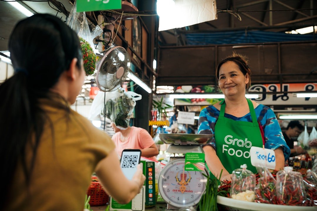 a woman standing behind a counter in a store